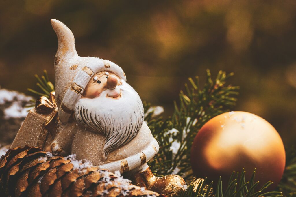 white gnome with christmas ball ball 