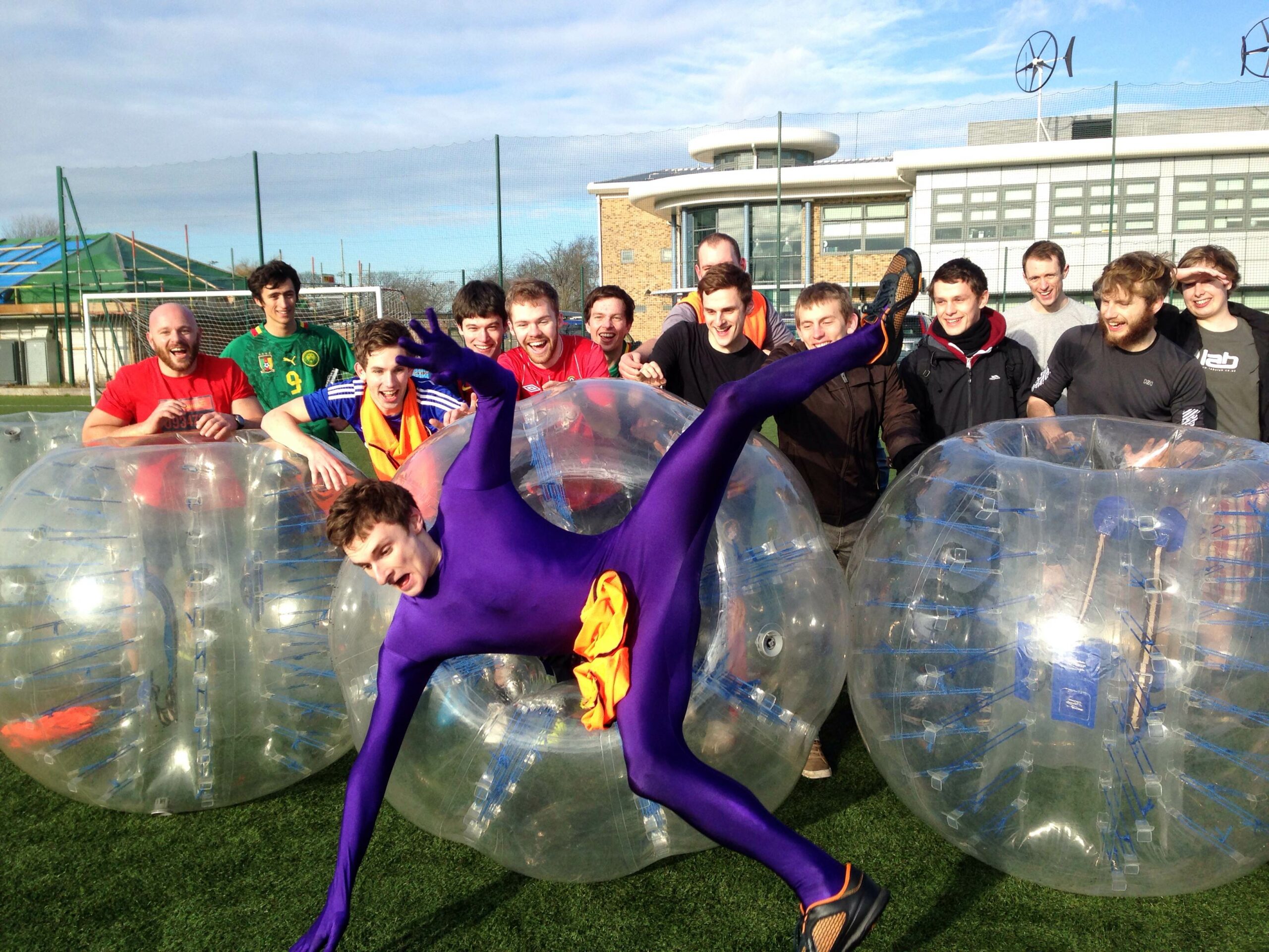 Man falls out of Zorbing football as crowd watch and laugh