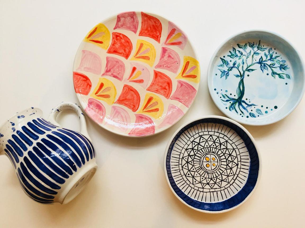 Painted ceramics including a plates and a jug