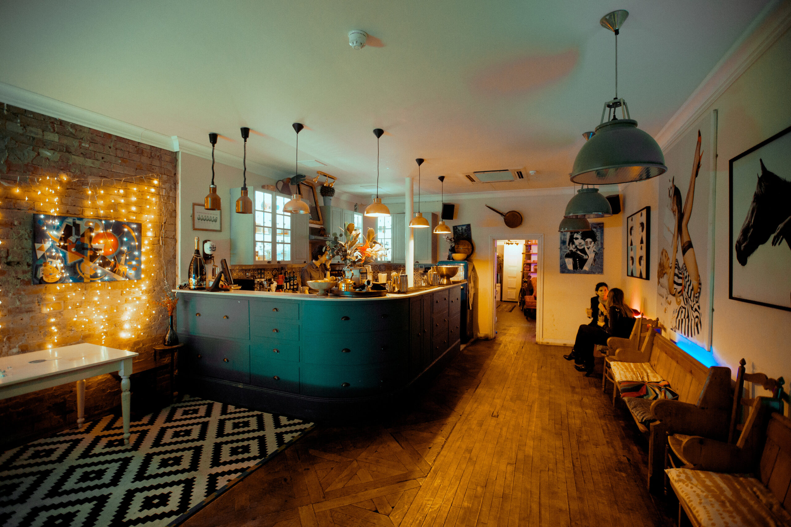 Little Blue Door interior - kitchen-bar hybrid with colourful tiles
