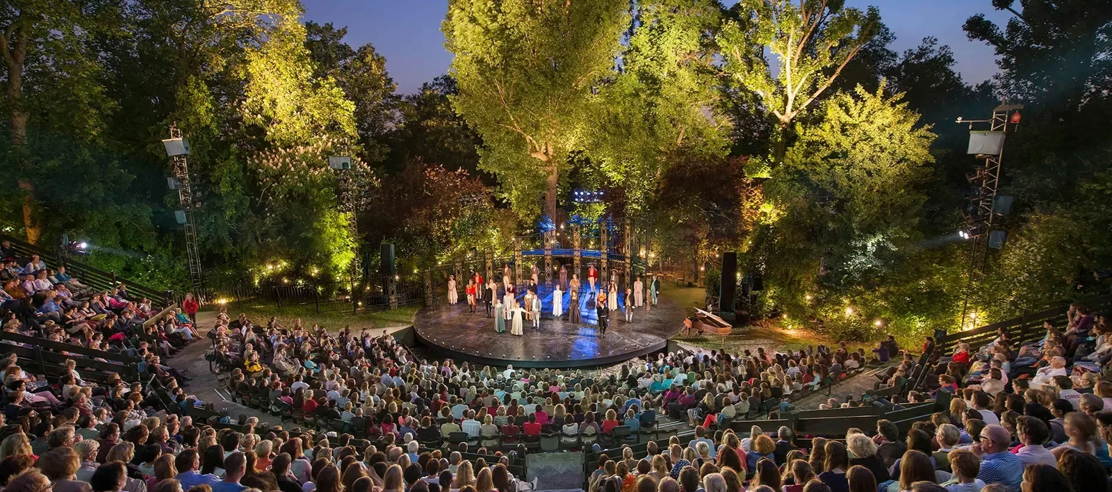 a picture of an outdoor theatre with a large audience