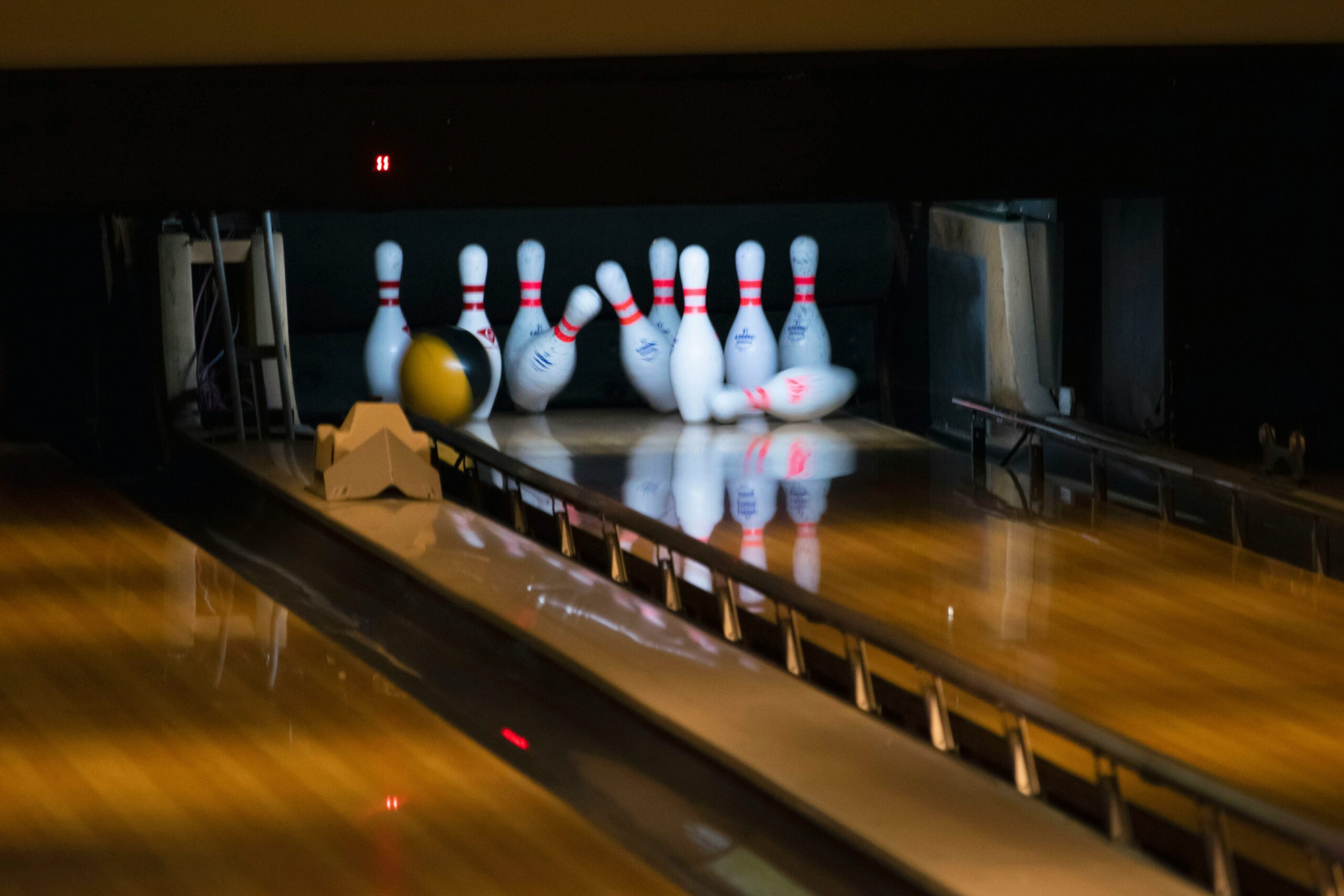 bowling pins being knocked over